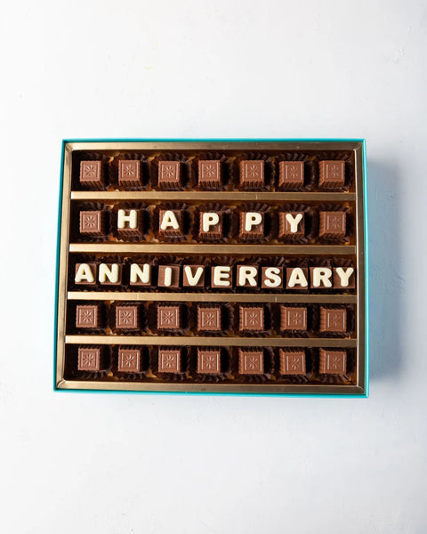 Chocolate box with 'Happy Anniversary' message on a white background