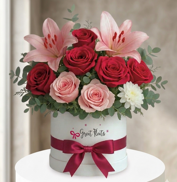Hand-picked red and pink roses with lilies in a white premium gift box"