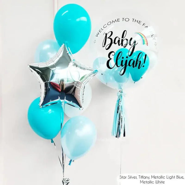Personalized baby welcome balloon bouquet with 'Baby Elijah!' text, star foil, and light blue tones for UAE celebrations