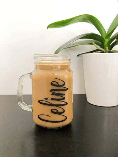 Personalized glass mug with name 'Celine' filled with coffee, ideal for custom gifts in UAE