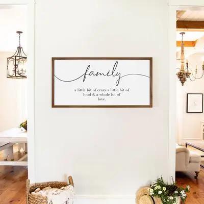 Wood-framed 'family' wall art with cursive quote, perfect for home decor in Dubai and UAE