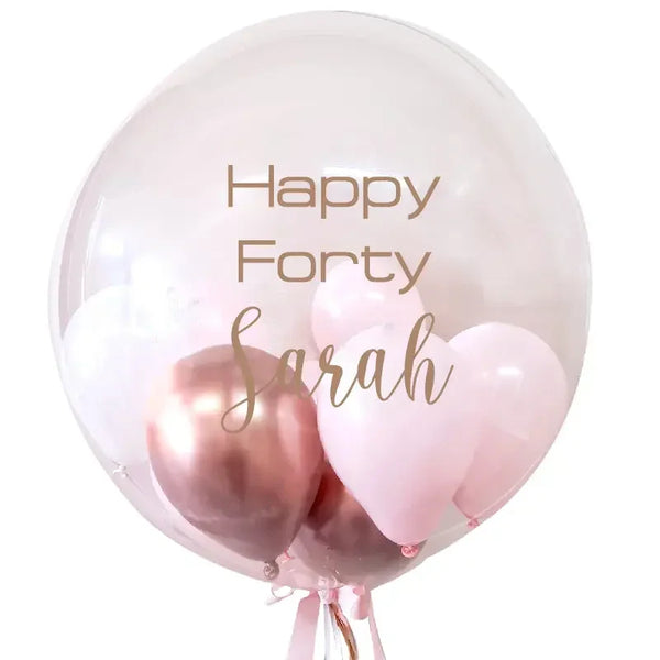 Personalized 'Happy Forty Sarah' balloon bouquet in pink and rose gold for 40th birthday celebrations