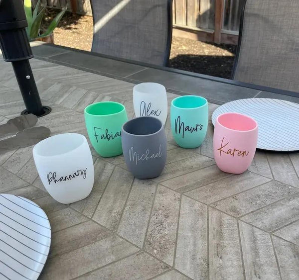 Personalized name tumblers in pastel colors for birthday gifts, outdoor patio setting
