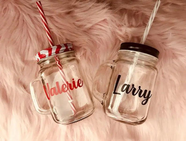 Personalized glass mason jars with names Valerie and Larry, perfect for birthday gifts or UAE celebrations
